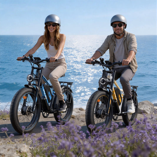 Two people riding electric bikes by the ocean with lavender flowers in the foreground.